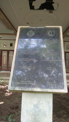 3D rendering of modern high-rise building with glass façade and complex geometric shapes